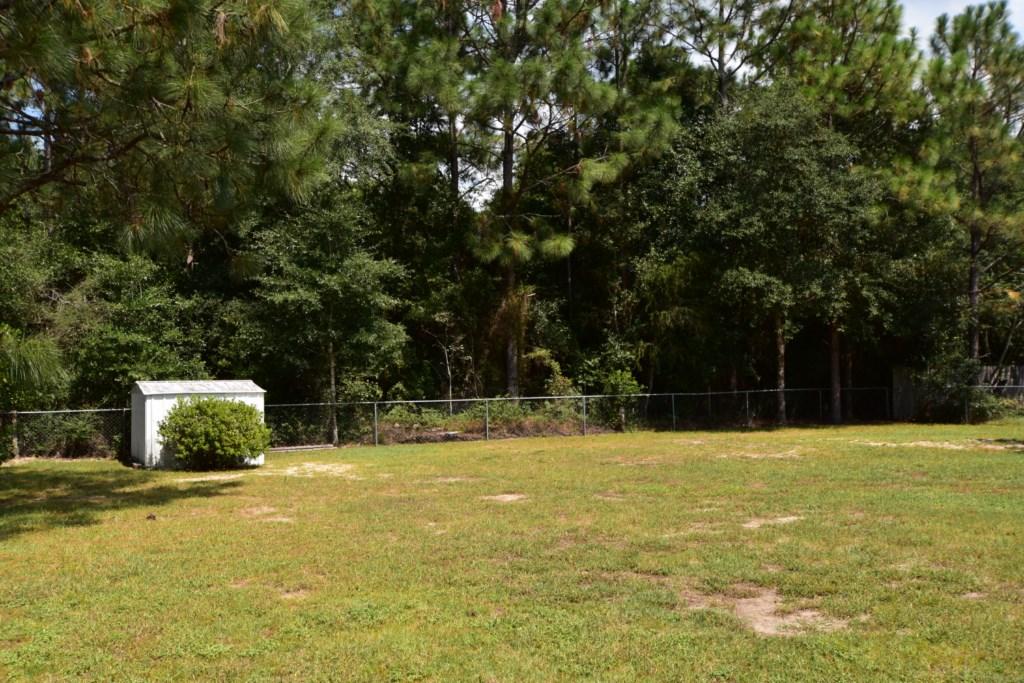 2840 Old Mill Way Crestview, FL 32539 - Photo 30 of 35 a view of a swimming pool with a yard