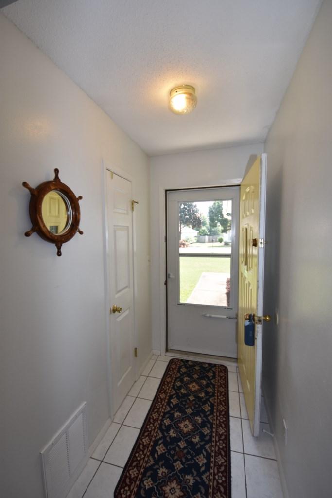 2840 Old Mill Way Crestview, FL 32539 - Photo 3 of 35 a bathroom with a window and a shower