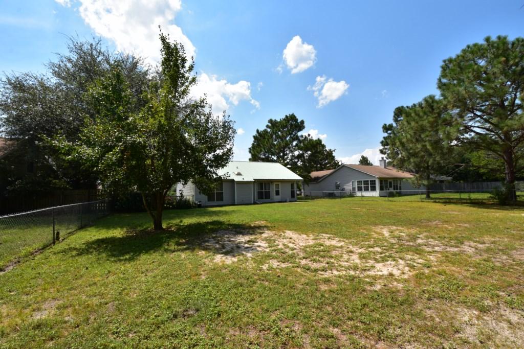 2840 Old Mill Way Crestview, FL 32539 - Photo 32 of 35 a front view of a house with a yard and trees
