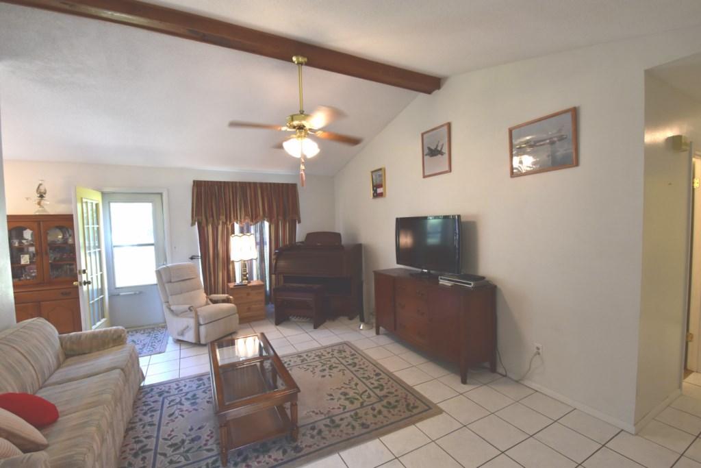 2840 Old Mill Way Crestview, FL 32539 - Photo 4 of 35 a living room with furniture and a flat screen tv