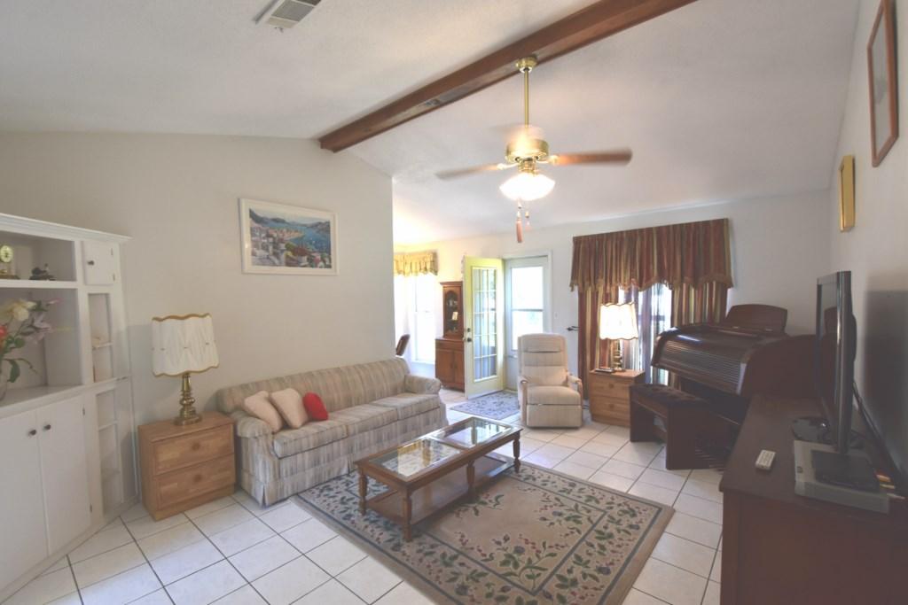 2840 Old Mill Way Crestview, FL 32539 - Photo 5 of 35 a living room with furniture and wooden floor