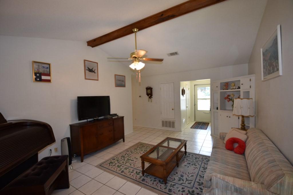 2840 Old Mill Way Crestview, FL 32539 - Photo 9 of 35 a living room with furniture and a flat screen tv