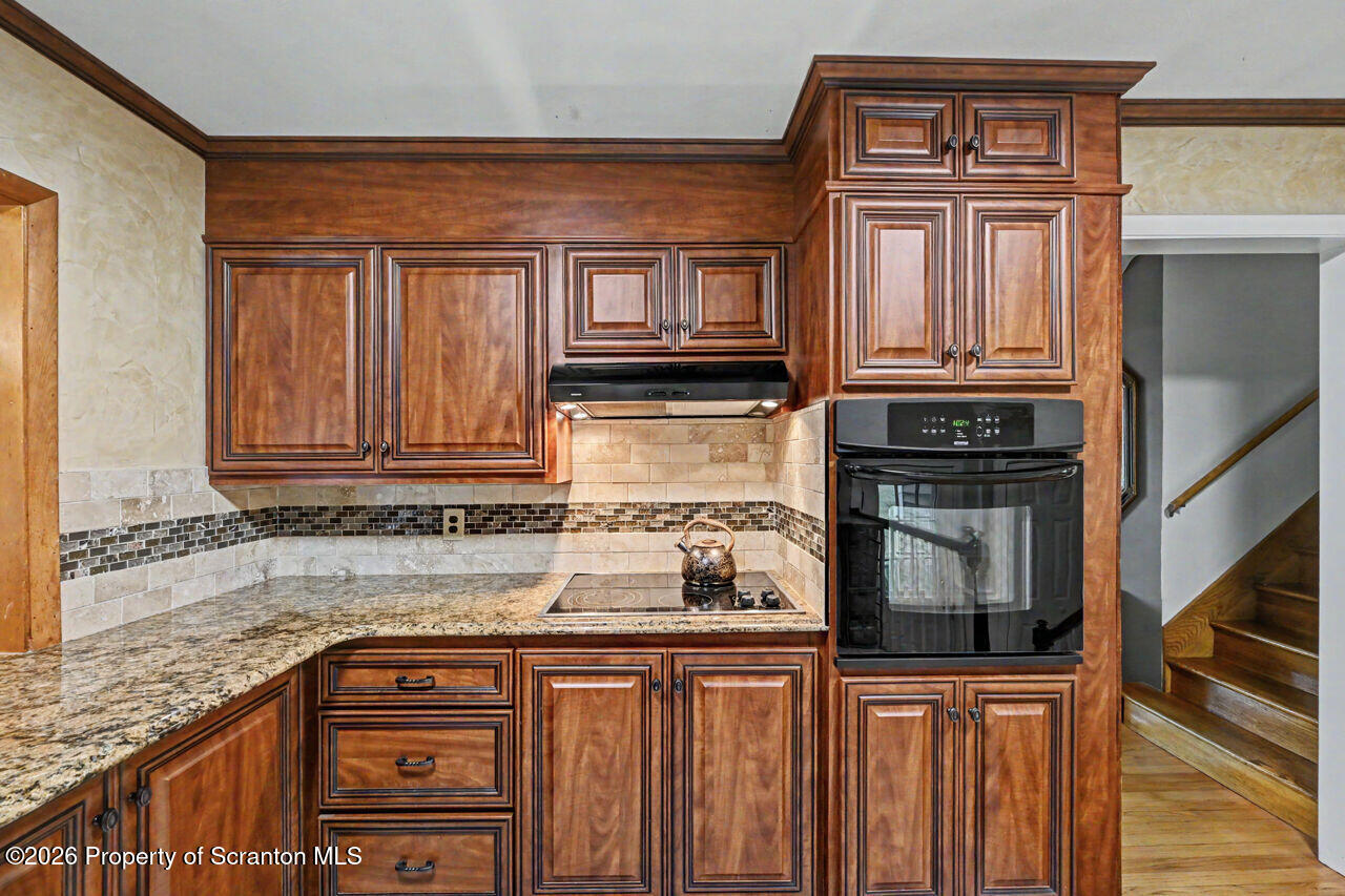 121 T Rt 351 Moscow, PA 18444 - Photo 28 of 79 a kitchen with granite countertop a refrigerator and cabinets