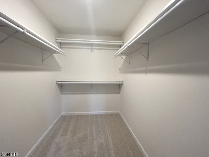 223 Myrtle Road Warren, NJ 07059 - Photo 7 of 17 a view of a room with racks on the wall