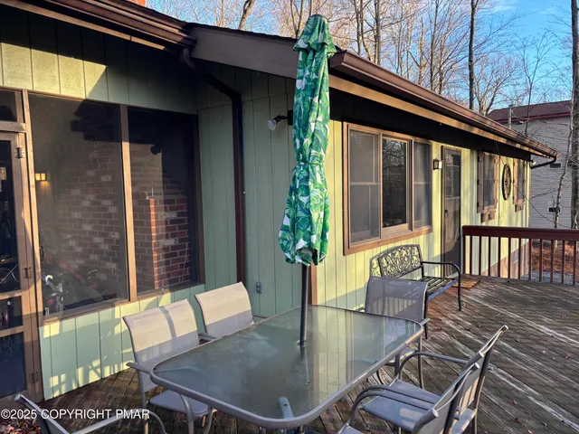 a view of a dining room with furniture and a chandelier