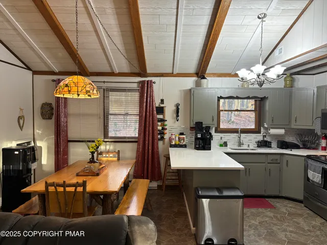 a kitchen with a sink stove and microwave