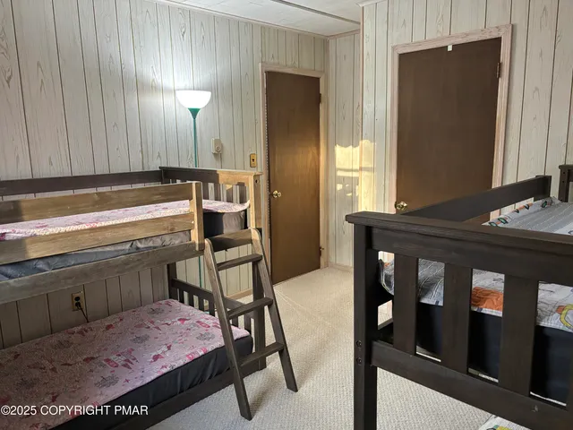 a bedroom with a bed and a closet