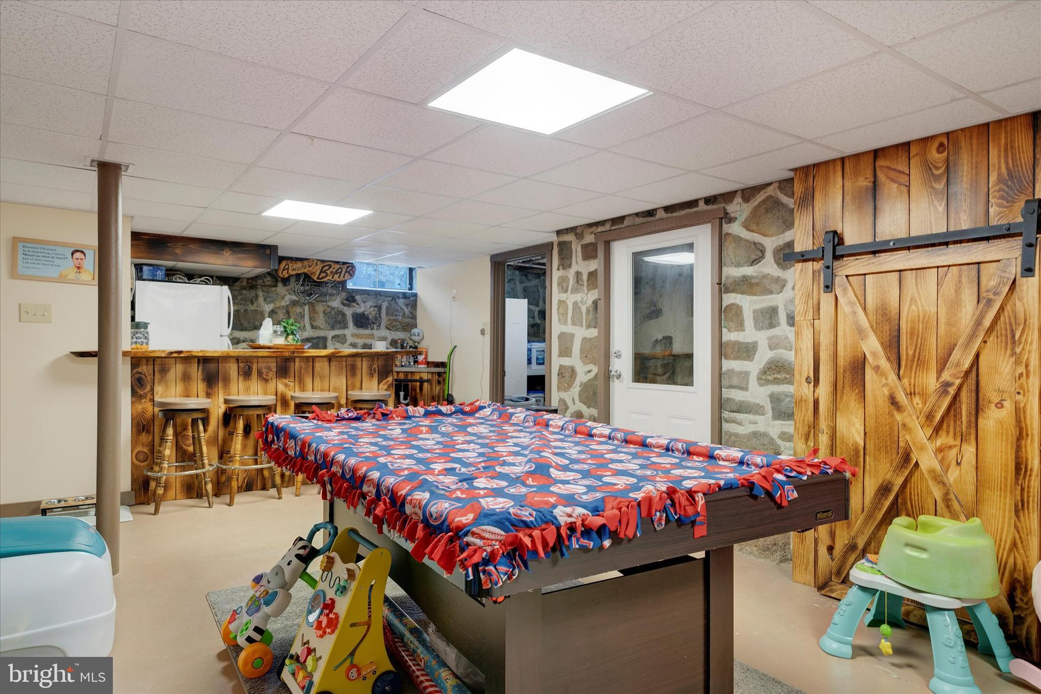 570 Oysterdale Road Oley, PA 19547 - Photo 18 of 26 a bed room with a bed and a table