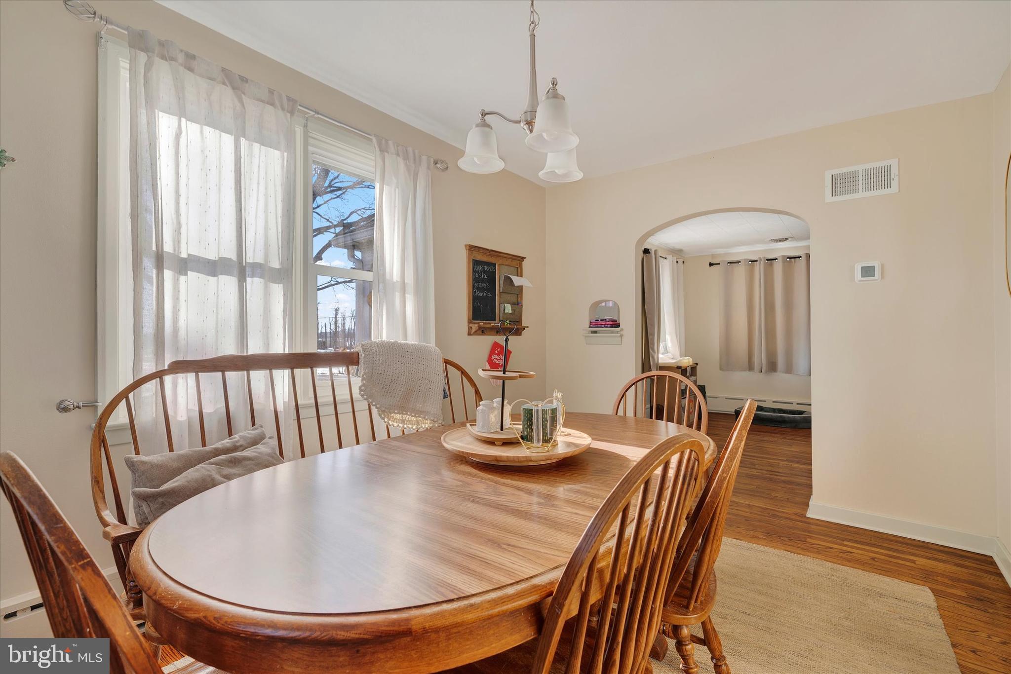570 Oysterdale Road Oley, PA 19547 - Photo 5 of 26 a dining room with furniture window and wooden floor