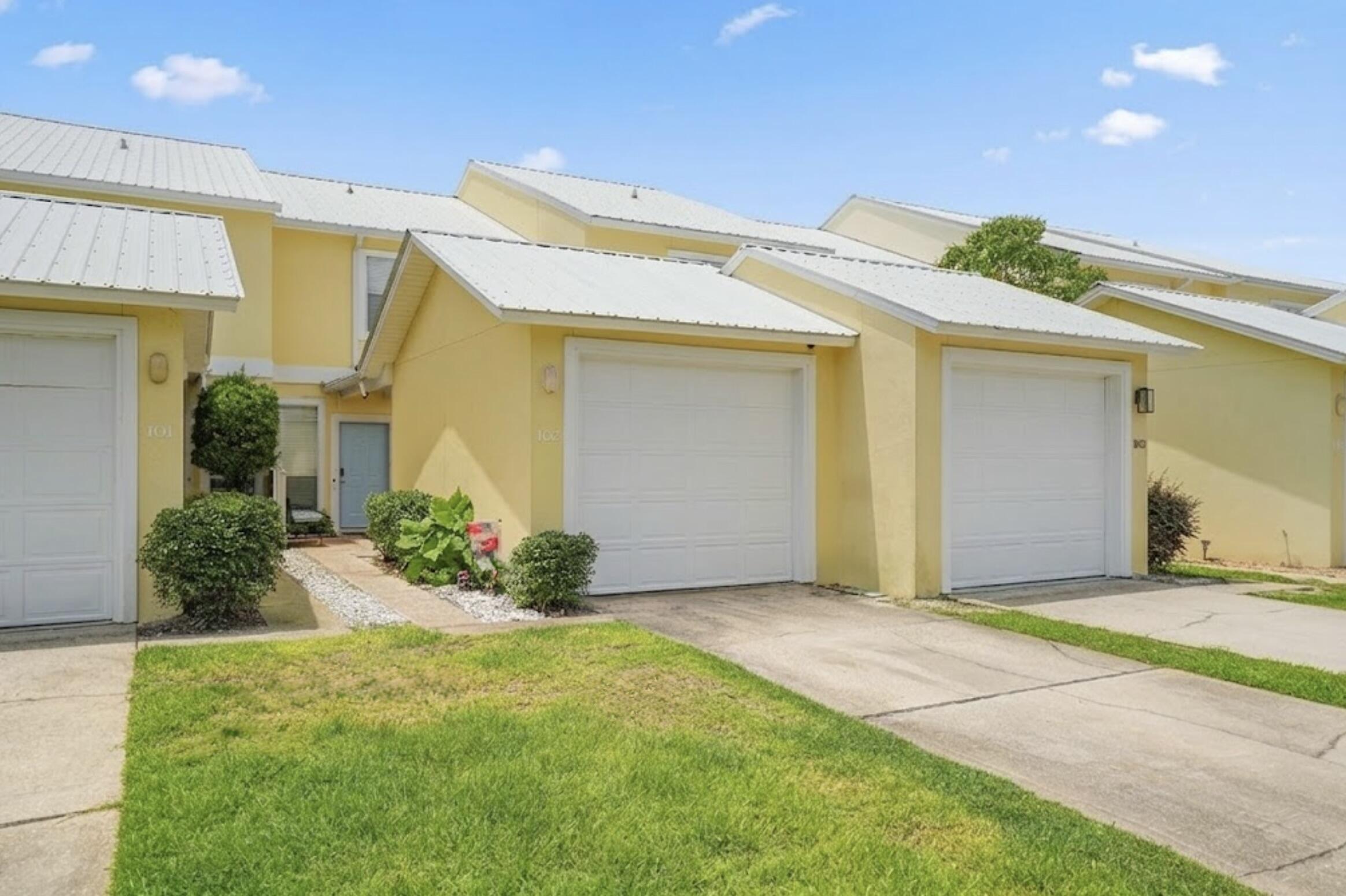 450 South Geronimo Street, Unit 102 Miramar Beach, FL 32550 - Photo 32 of 39 Garage door closed
