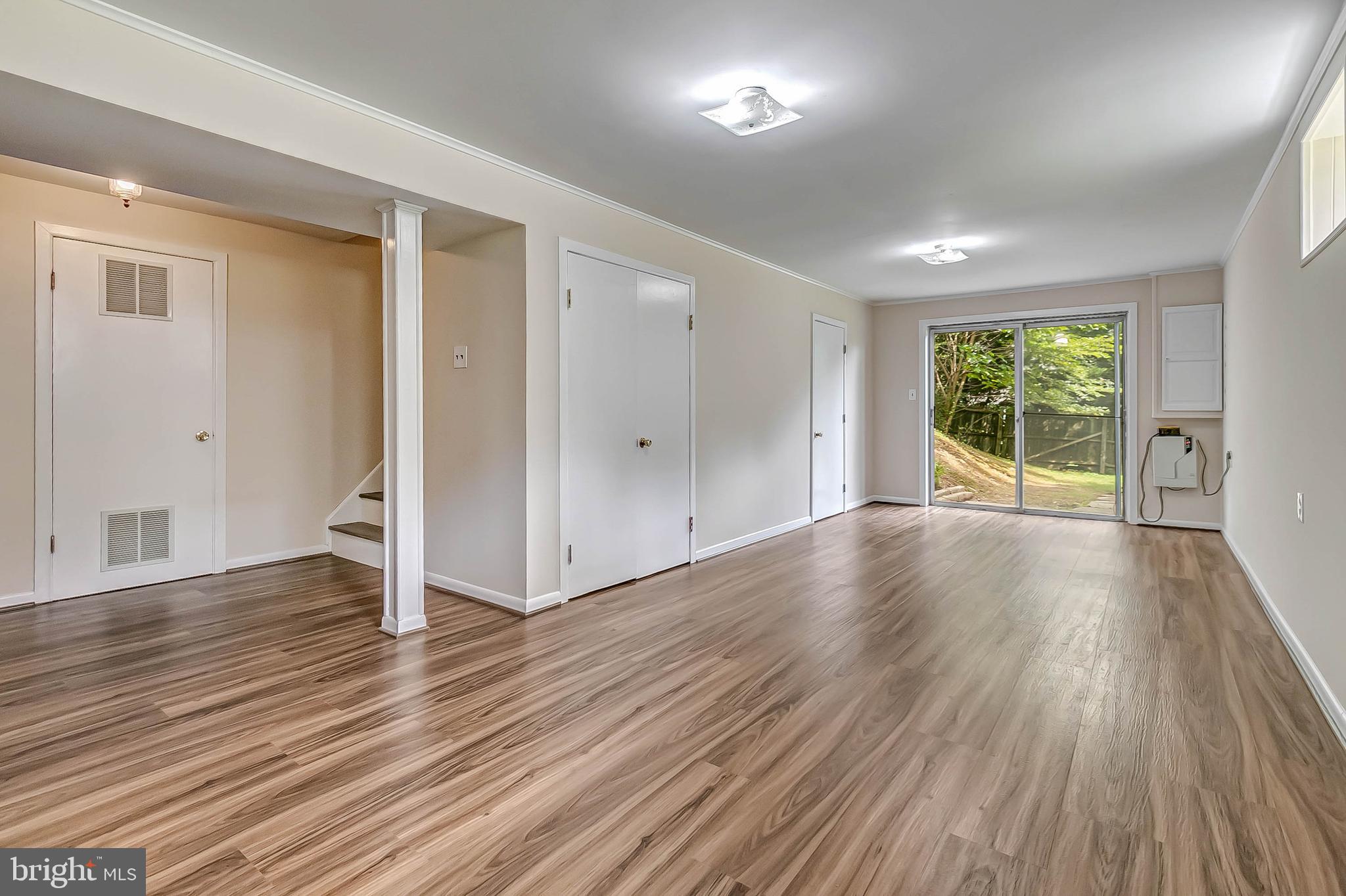 3229 Birchtree Lane Silver Spring, MD 20906 - Photo 34 of 44 Walk out basement with new laminate floors