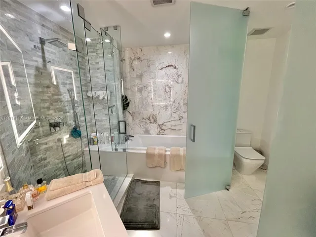 a bathroom with a shower and a toilet
