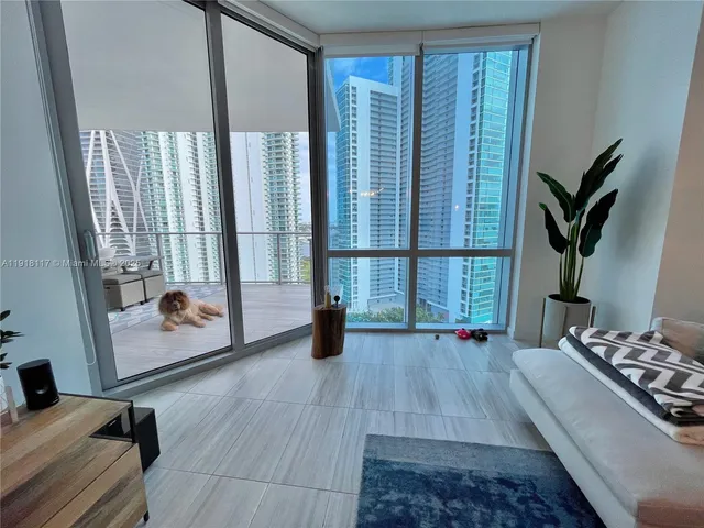 a bed room with a bed and a window