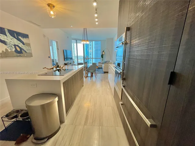 a view of a dining room with furniture wooden floor and a rug