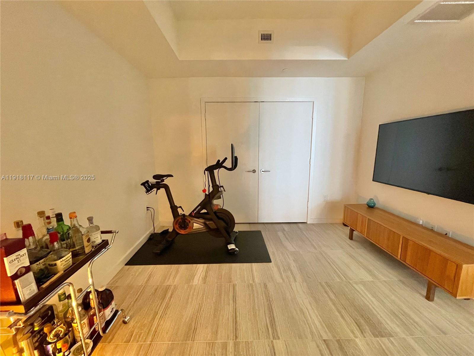 851 Northeast 1st Avenue, Unit 2605 Miami, FL 33132 - Photo 36 of 49 a living room with furniture and a flat screen tv