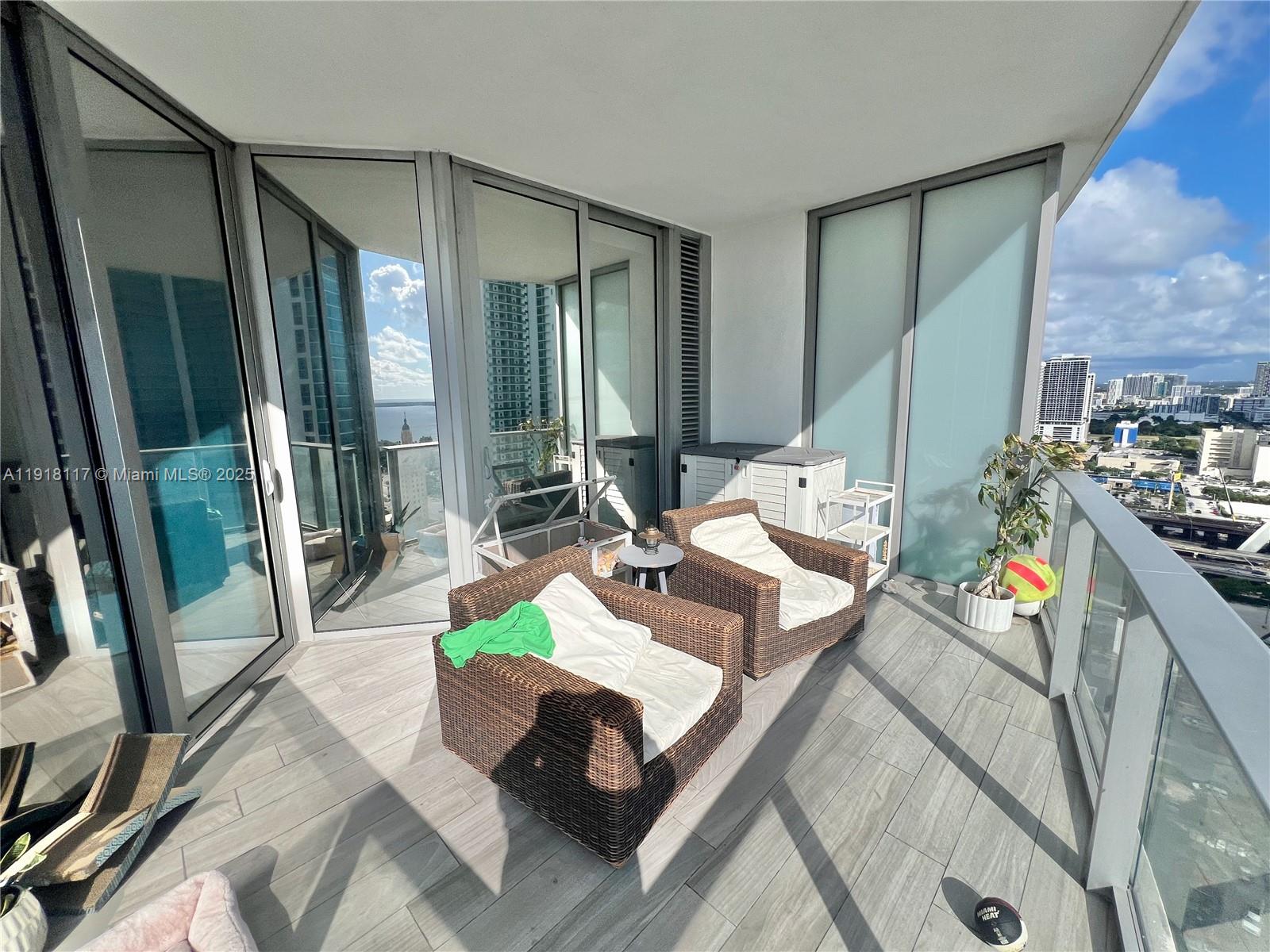 851 Northeast 1st Avenue, Unit 2605 Miami, FL 33132 - Photo 4 of 49 a living room with furniture and a fireplace