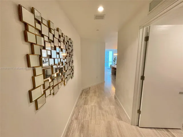 a view of entryway with window and stairs