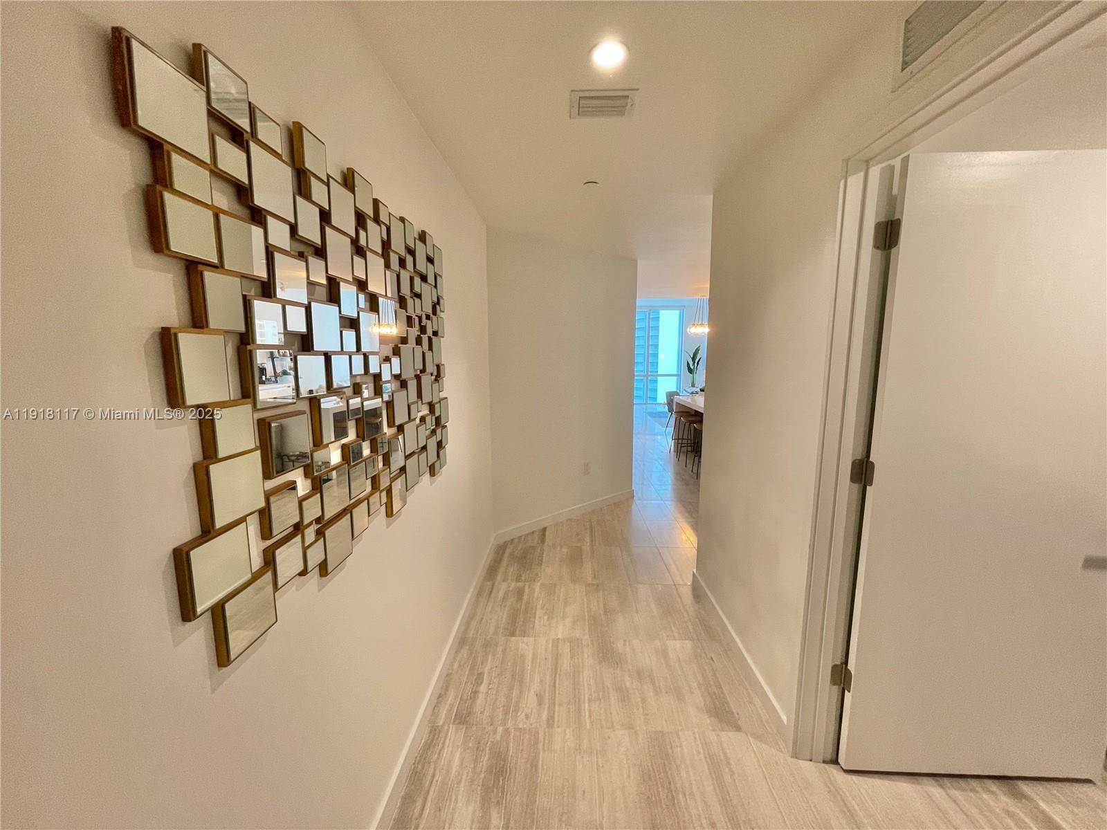 851 Northeast 1st Avenue, Unit 2605 Miami, FL 33132 - Photo 43 of 49 a view of entryway with wooden floor