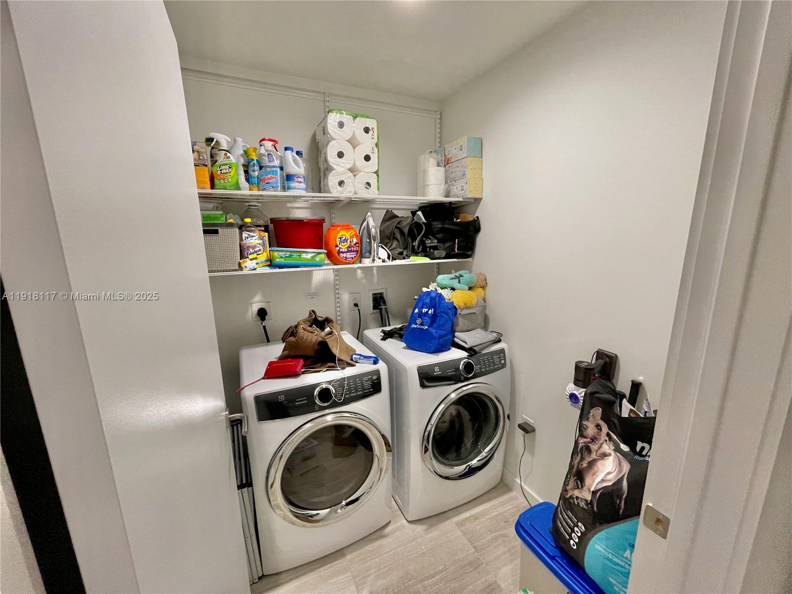 851 Northeast 1st Avenue, Unit 2605 Miami, FL 33132 - Photo 44 of 49 a storage room with washer and dryer
