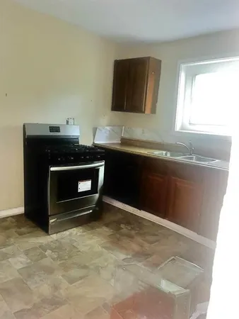 a room with a fireplace and a sink