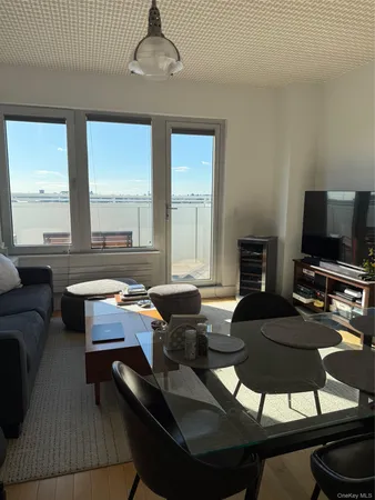 a living room with fireplace furniture and a flat screen tv