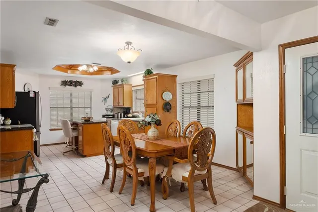 a dining room with furniture and chandelier or bathroom