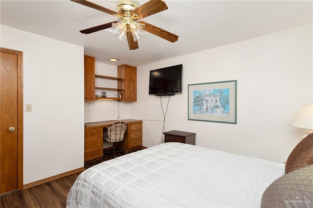 2602 Ashley Drive Pharr, TX 78577 - Photo 6 of 9 a bedroom with a bed and a flat screen tv