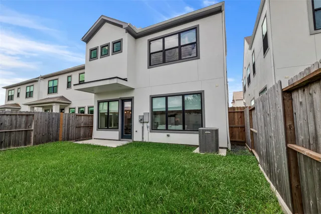 a view of a house with a yard and porch