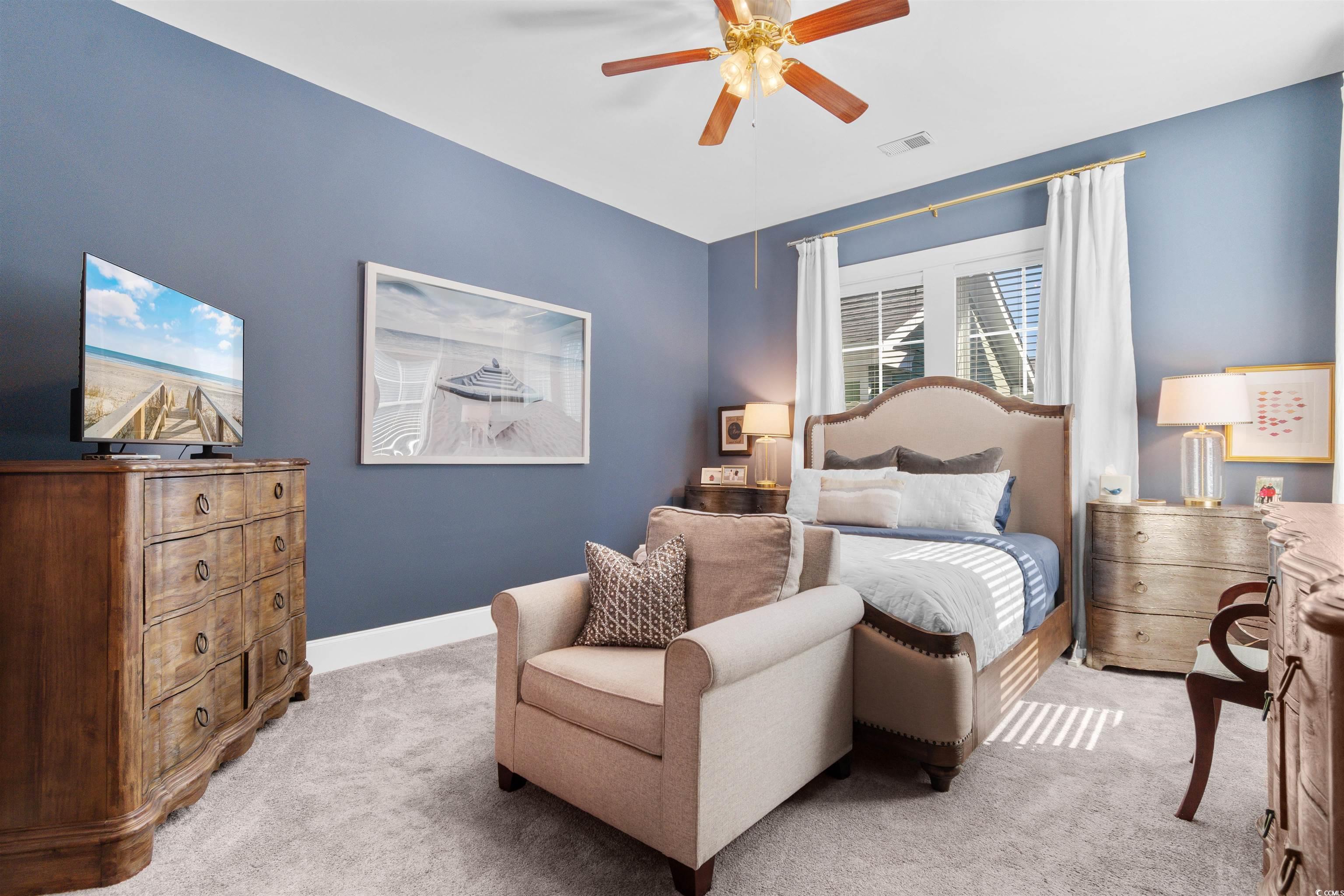 3448 Baldwin Lane Myrtle Beach, SC 29577 - Photo 12 of 30 Carpeted bedroom with a ceiling fan and connected bathroom