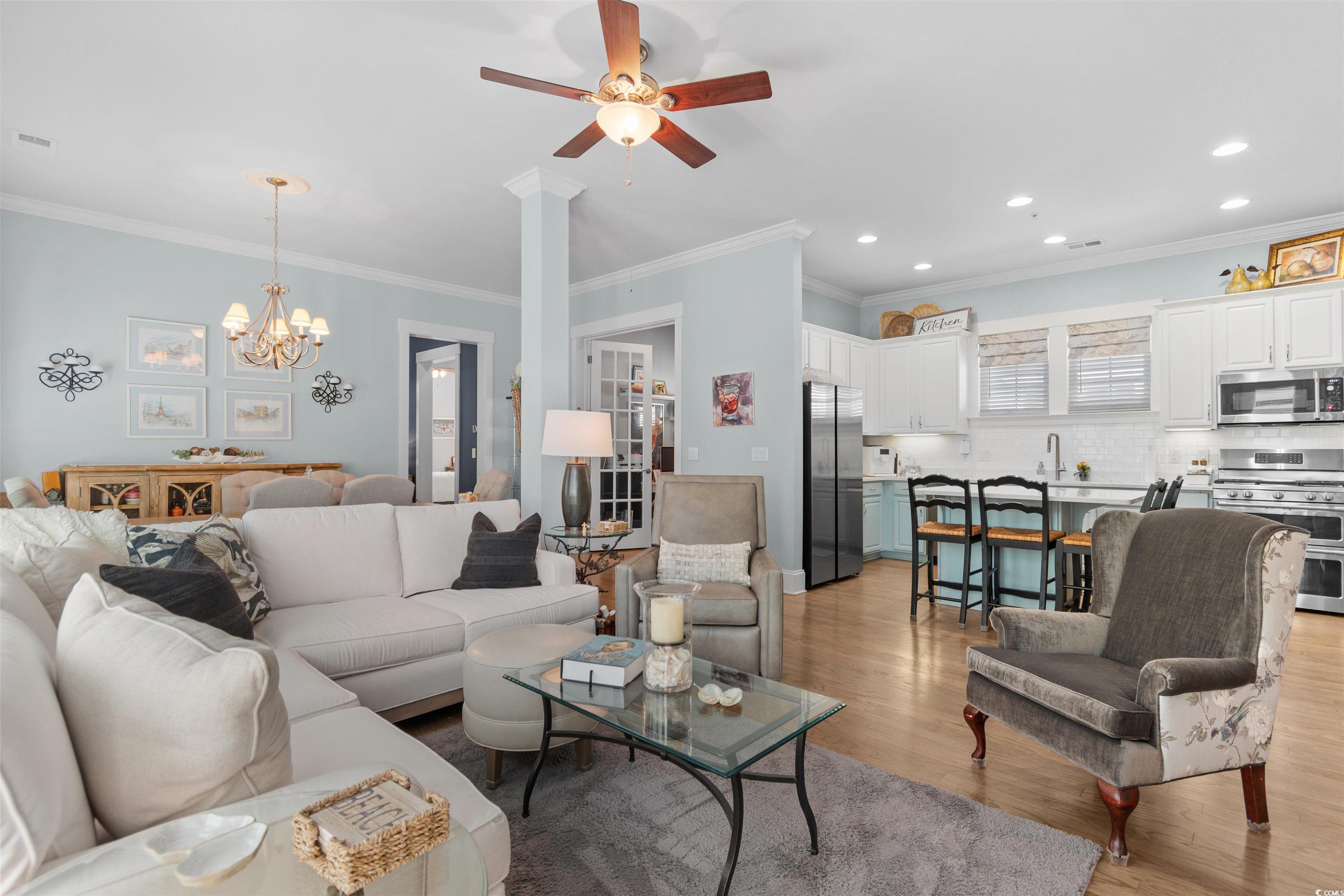 3448 Baldwin Lane Myrtle Beach, SC 29577 - Photo 8 of 30 Living room with crown molding, light wood-style flooring, a chandelier, ceiling fan, and recessed lighting