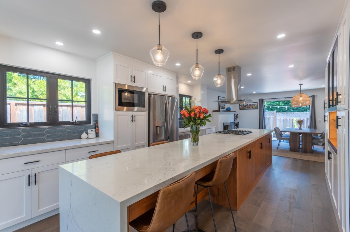 3039 Sloat Road Pebble Beach, CA 93953 - Photo 12 of 34 a kitchen with stainless steel appliances granite countertop counter space a sink cabinets and wooden floor