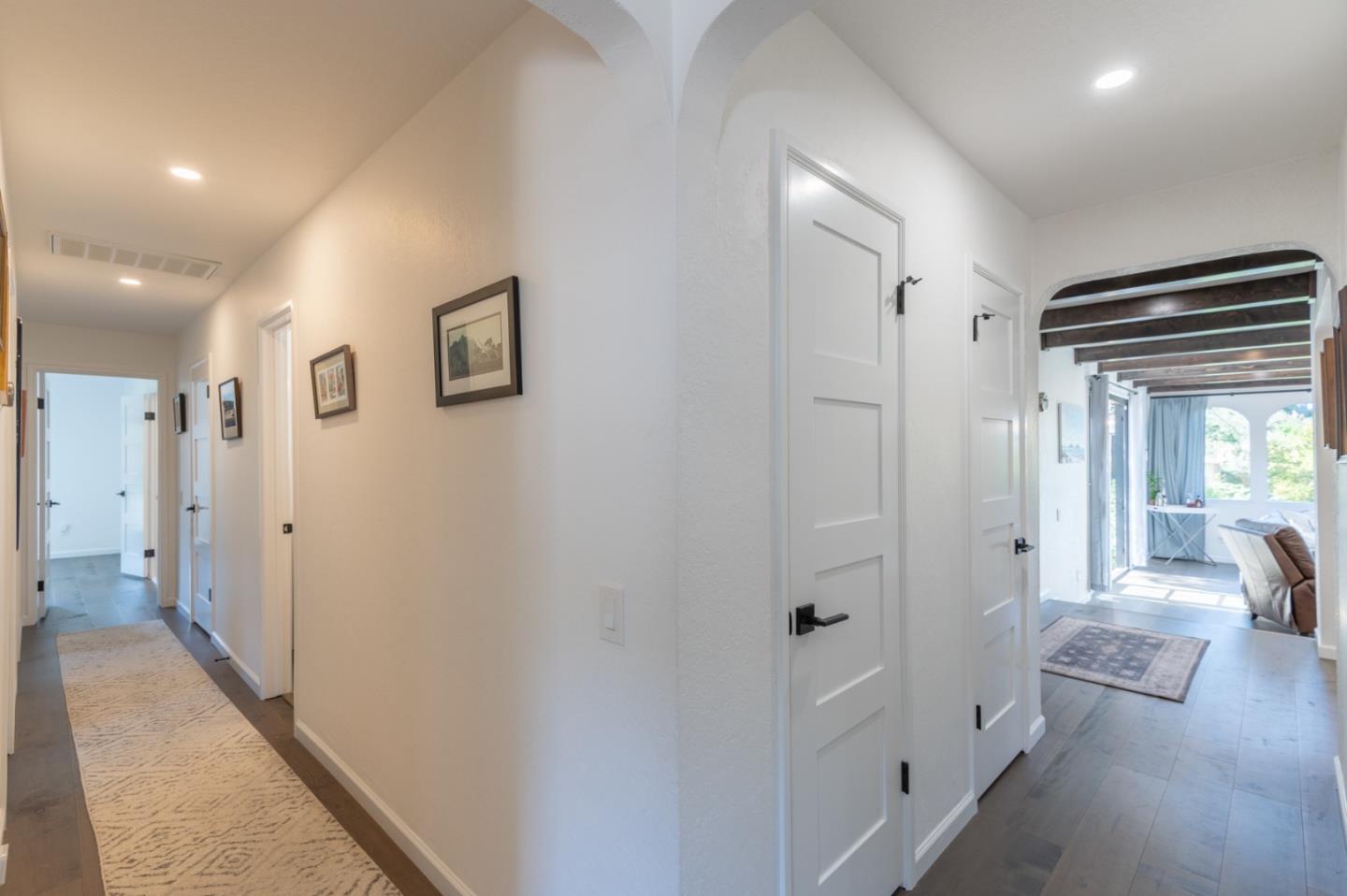 3039 Sloat Road Pebble Beach, CA 93953 - Photo 23 of 34 a view of a hallway with wooden floor and closet
