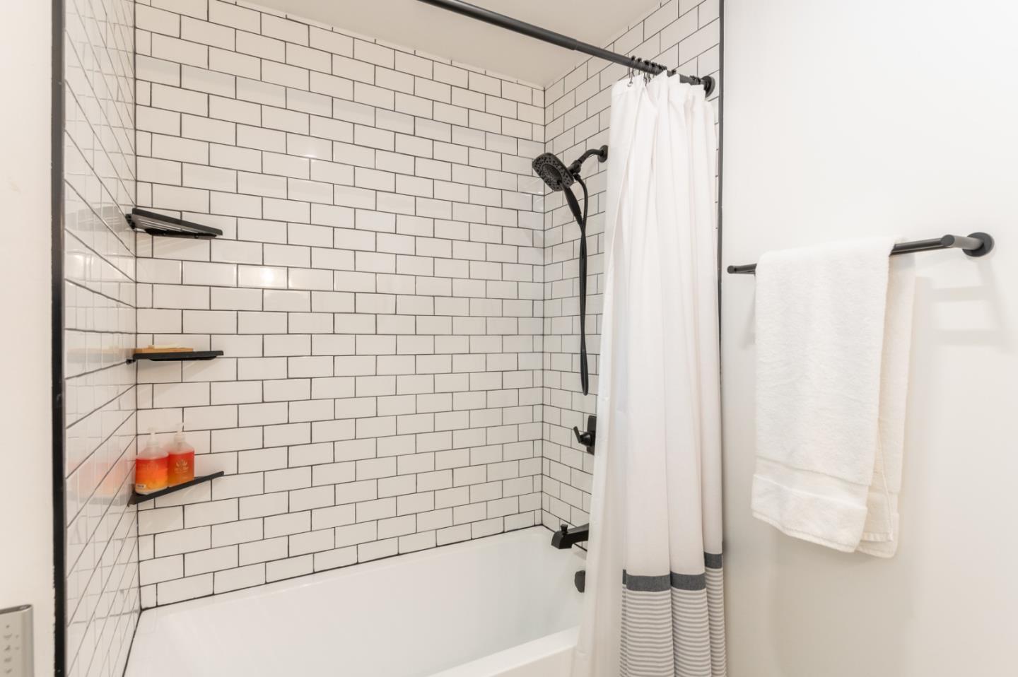 3039 Sloat Road Pebble Beach, CA 93953 - Photo 25 of 34 a bathroom with a shower and a bath tub