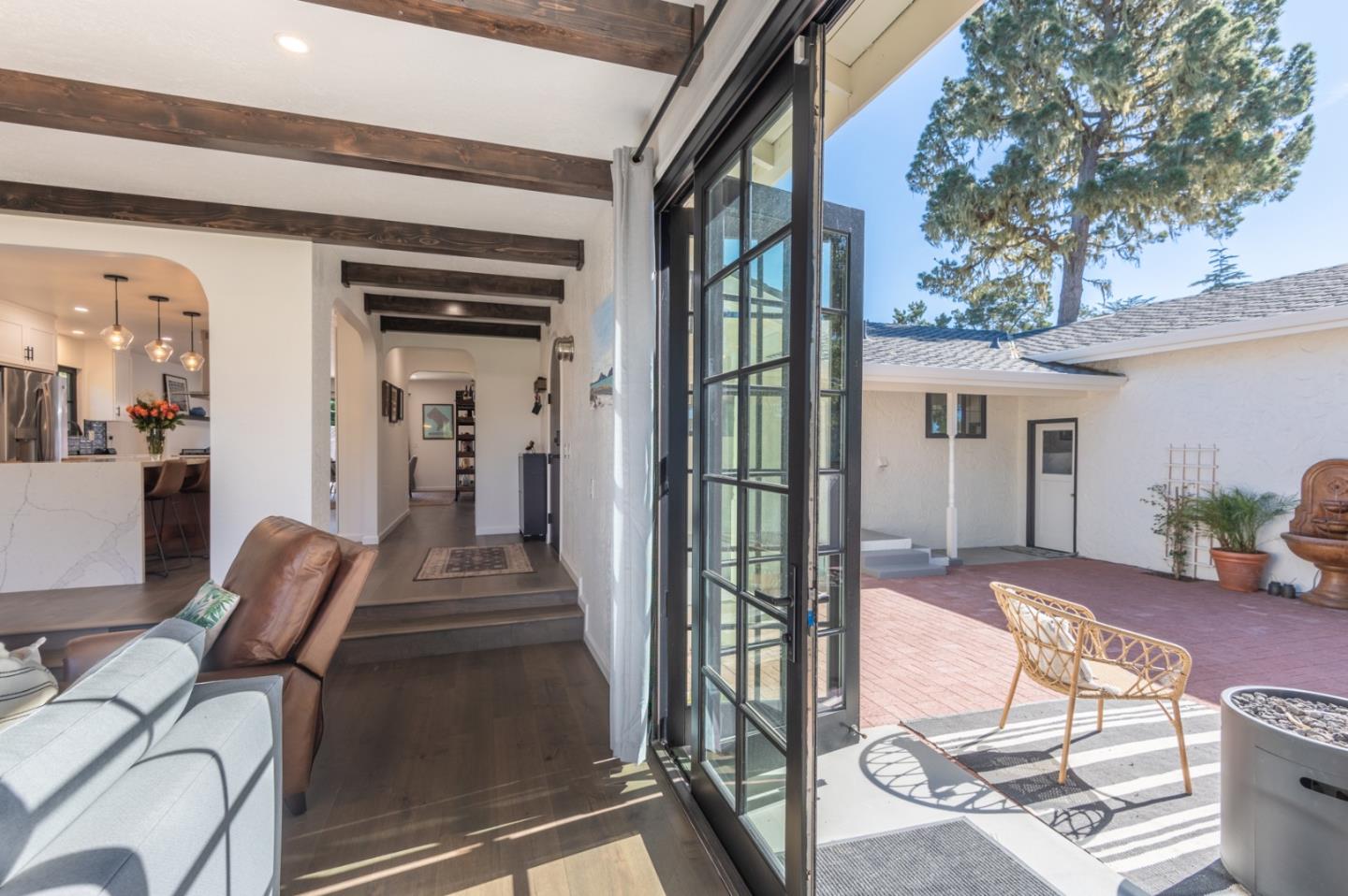 3039 Sloat Road Pebble Beach, CA 93953 - Photo 9 of 34 a view of living room kitchen and entryway
