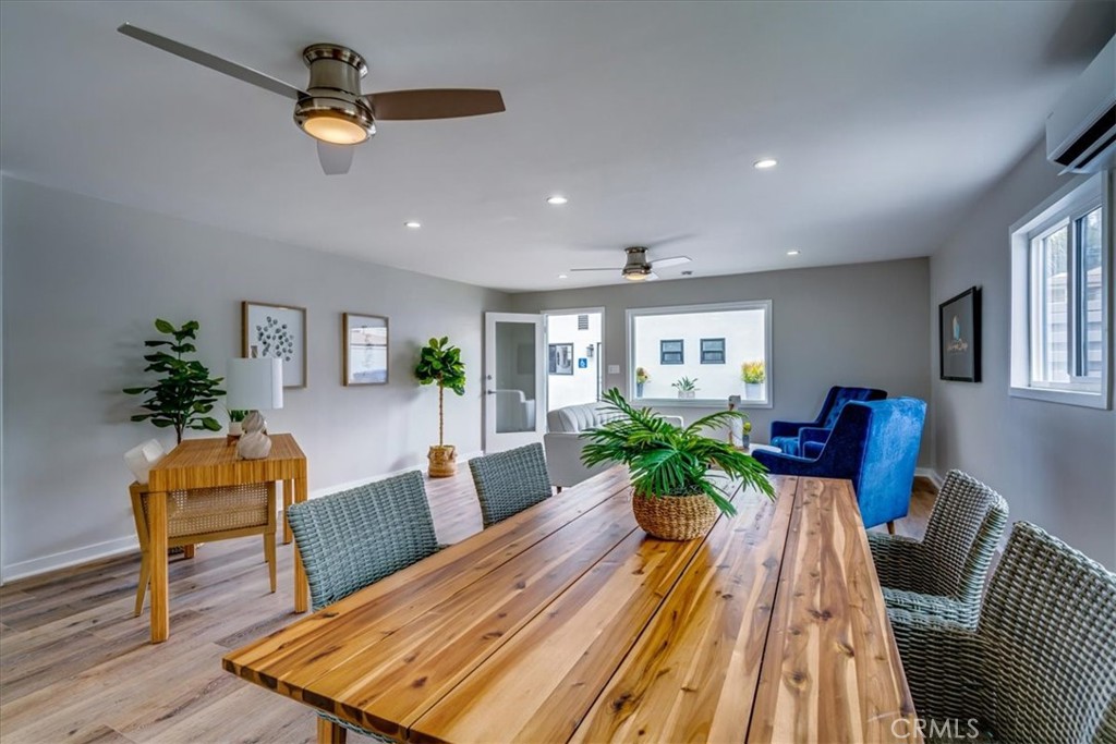 323 Culver Boulevard Playa del Rey, CA 90293 - Photo 16 of 58 a view of a dining room with furniture a potted plant and wooden floor