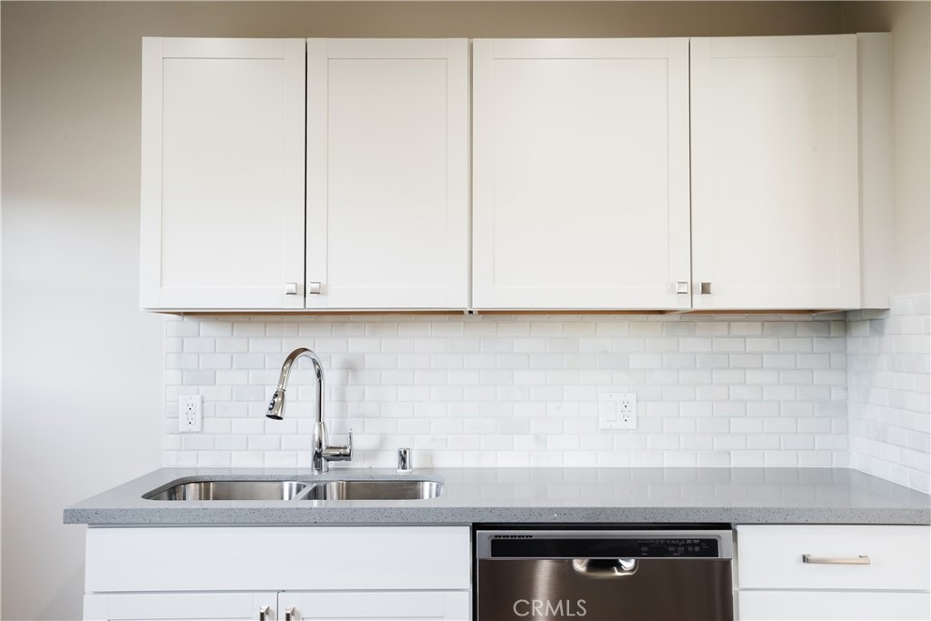 323 Culver Boulevard Playa del Rey, CA 90293 - Photo 18 of 58 a kitchen with a sink and cabinets