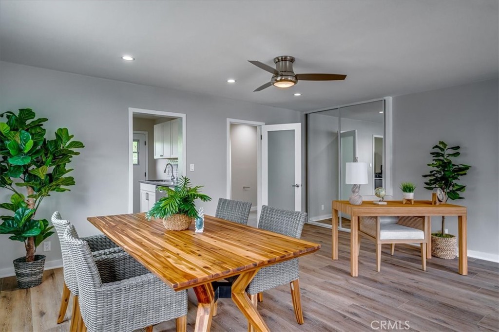 323 Culver Boulevard Playa del Rey, CA 90293 - Photo 28 of 58 a dining room with furniture potted plants and wooden floor