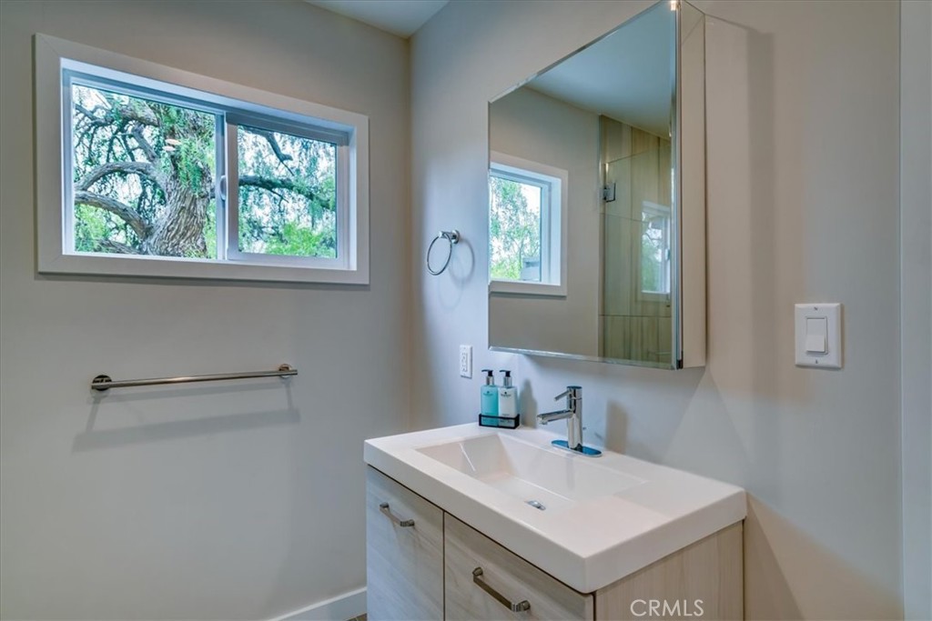 323 Culver Boulevard Playa del Rey, CA 90293 - Photo 40 of 58 a bathroom with a sink a vanity and a window