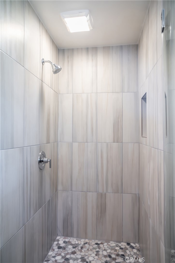 323 Culver Boulevard Playa del Rey, CA 90293 - Photo 42 of 58 a bathroom with a shower and a wooden door