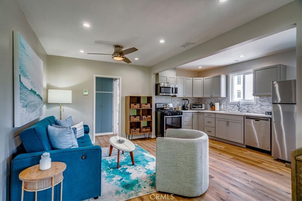 323 Culver Boulevard Playa del Rey, CA 90293 - Photo 43 of 58 a living room with stainless steel appliances kitchen island granite countertop furniture and a kitchen view