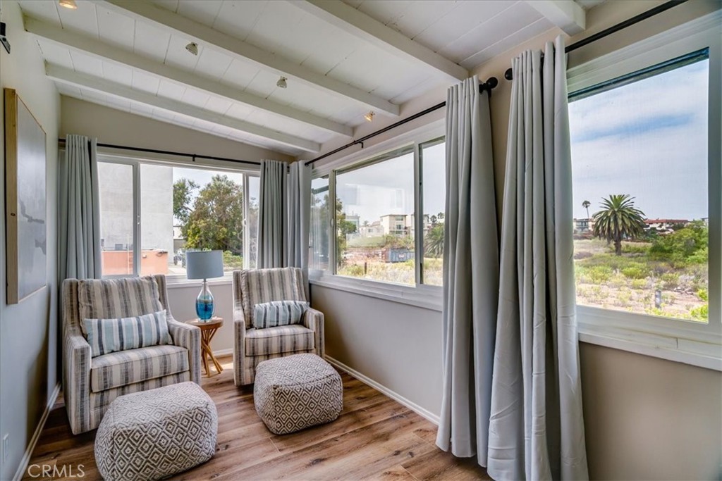 323 Culver Boulevard Playa del Rey, CA 90293 - Photo 49 of 58 a bedroom with furniture and a large window