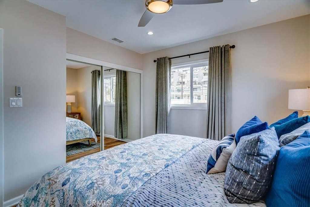 323 Culver Boulevard Playa del Rey, CA 90293 - Photo 56 of 58 a bedroom with a bed and window
