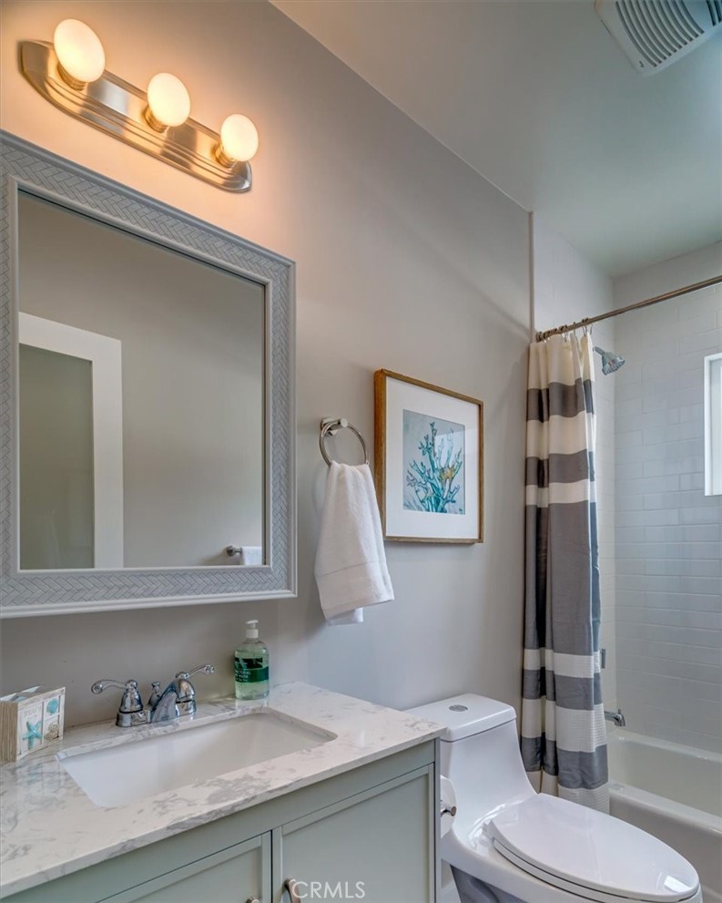 323 Culver Boulevard Playa del Rey, CA 90293 - Photo 57 of 58 a bathroom with a granite countertop sink mirror vanity and toilet