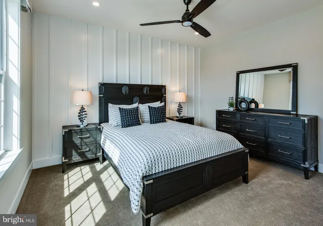 a bedroom with a bed and dresser