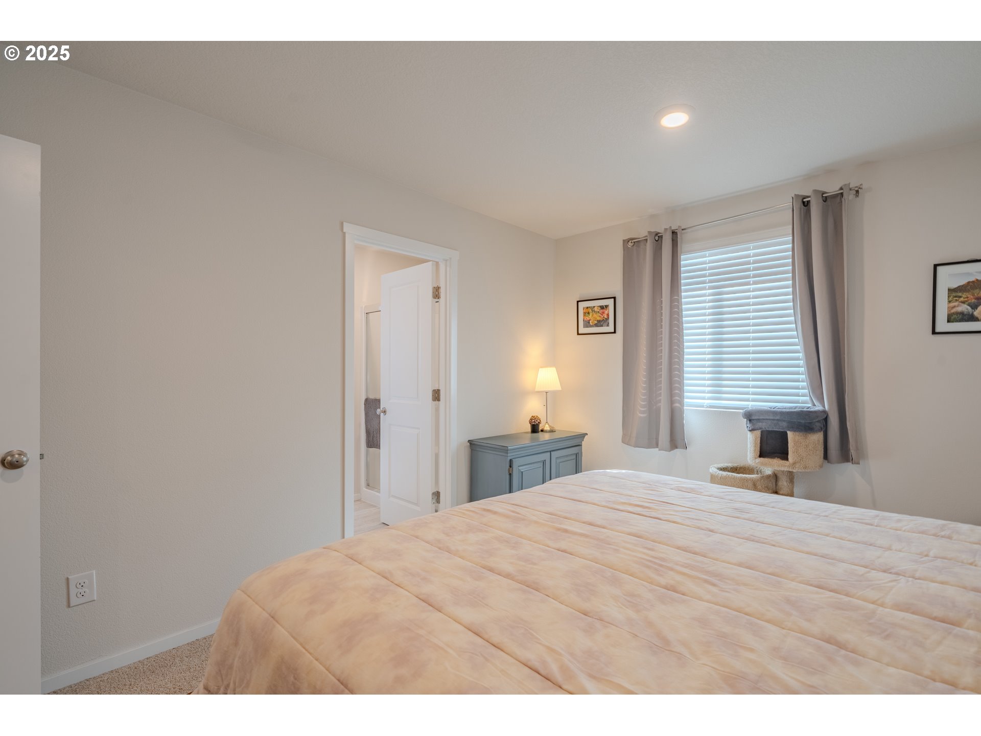 17414 Northwest 10th Place Ridgefield, WA 98642 - Photo 27 of 45 a bedroom with a bed and a night stand