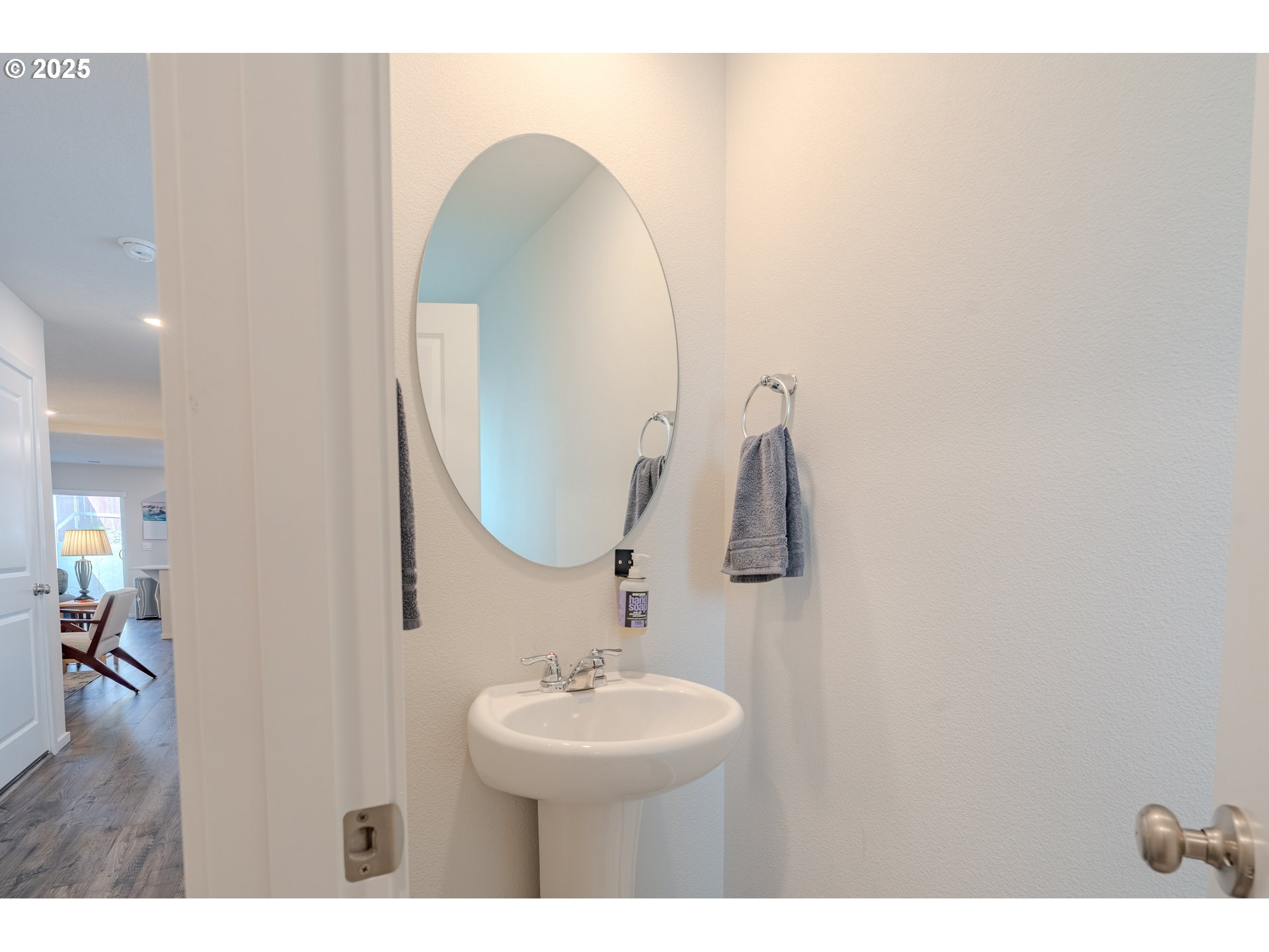 17414 Northwest 10th Place Ridgefield, WA 98642 - Photo 4 of 45 a bathroom with a sink and a mirror