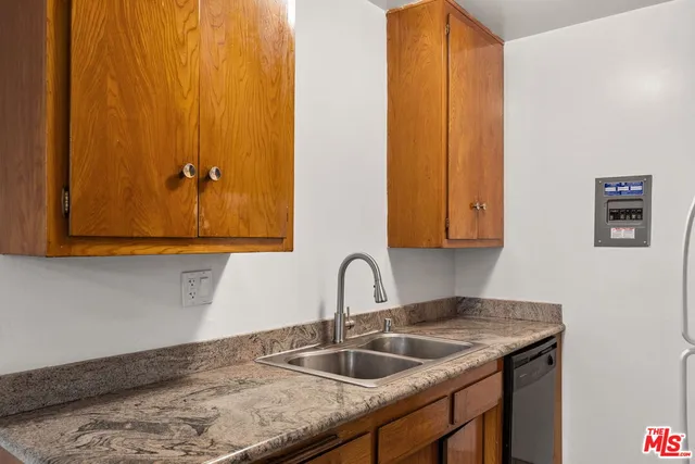 a kitchen with a sink and cabinets
