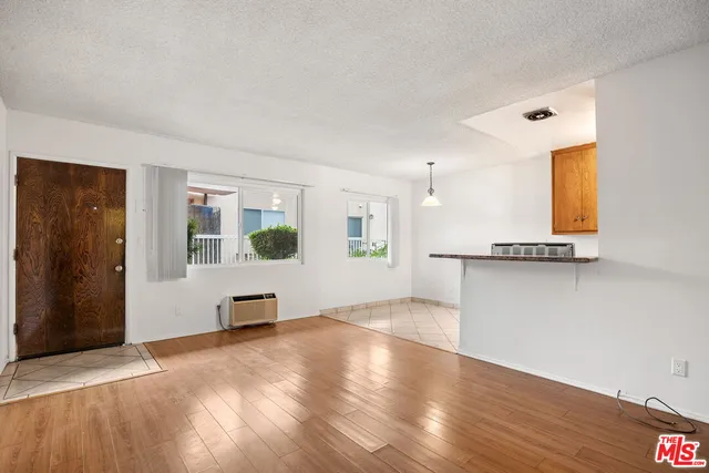 a view of a kitchen with furniture and a window