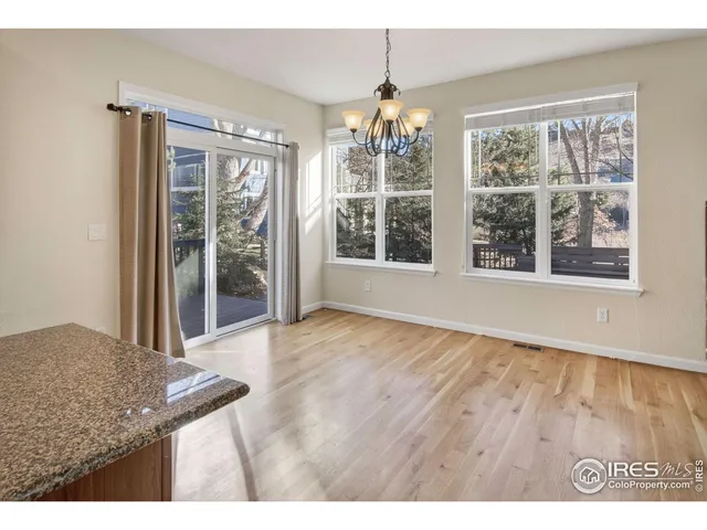 an aerial view of a house with a mountain