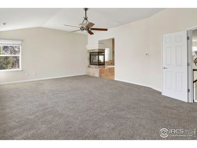 a view of livingroom with furniture wooden floor and chandelier